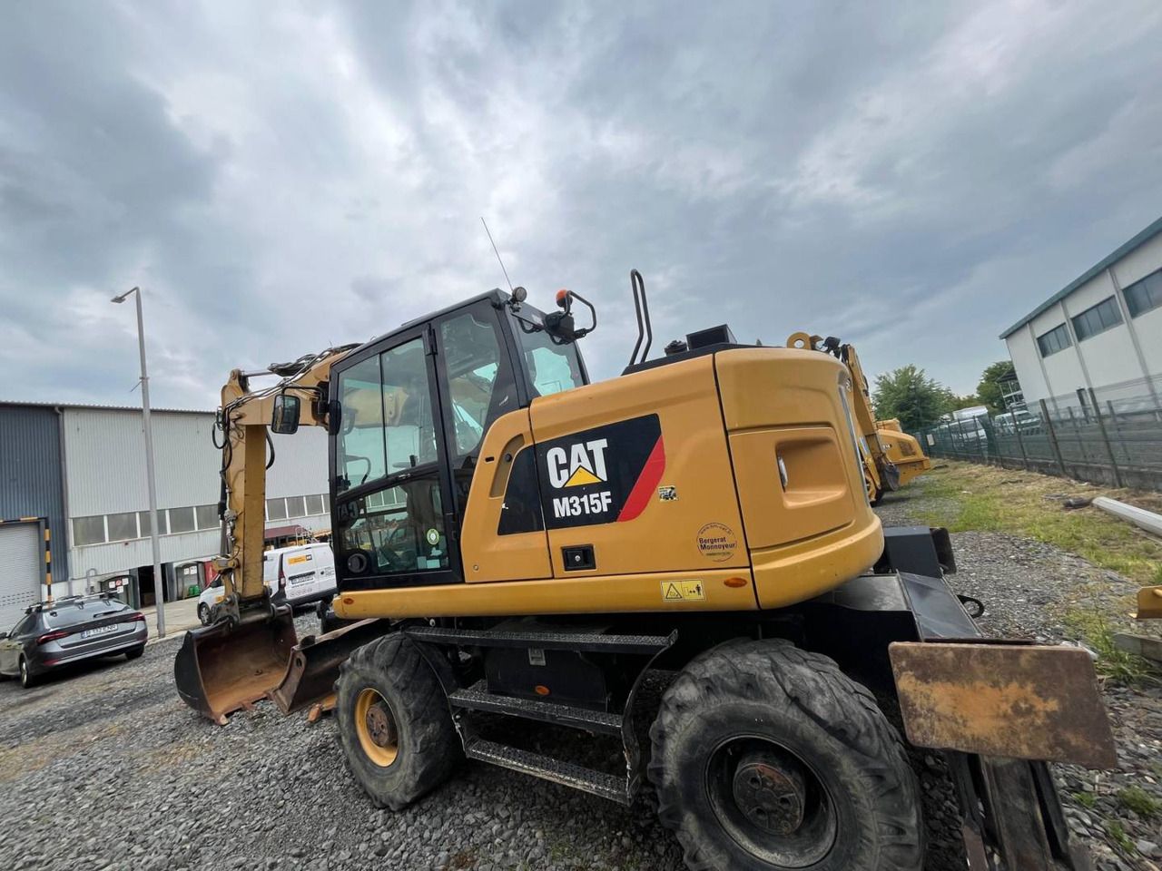 2018 Caterpillar M315F wheel excavator, rear three-quarter view