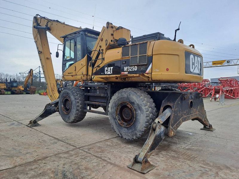 2009 Caterpillar M325D LMH material handler, rear three-quarter view 2009 Caterpillar M325D LMH material handler, rear three-quarter view