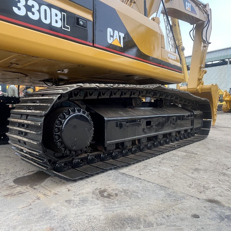 Caterpillar 330BL crawler excavator side view of tracks Caterpillar 330BL crawler excavator side view of tracks