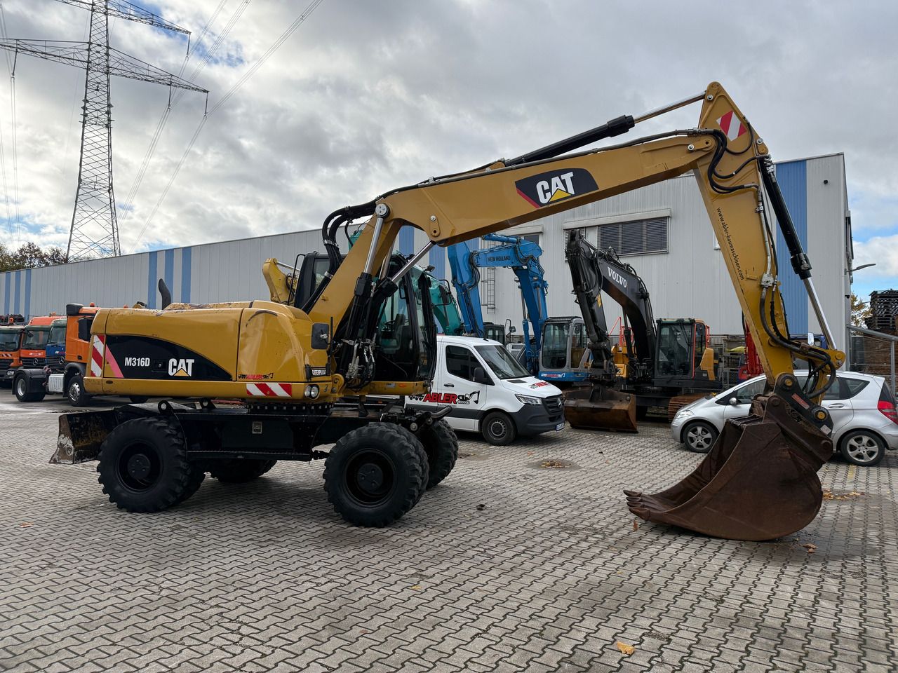 2010 Caterpillar M316D wheel excavator, side profile view