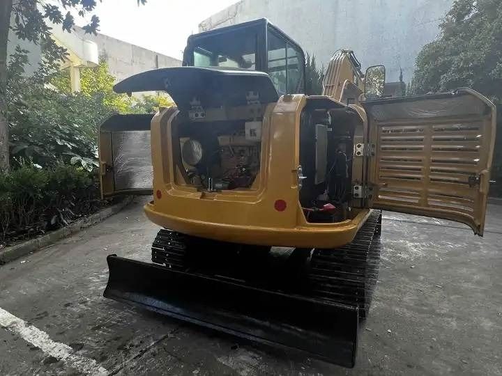 2024 Caterpillar 306E2 mini excavator rear view with engine compartment open