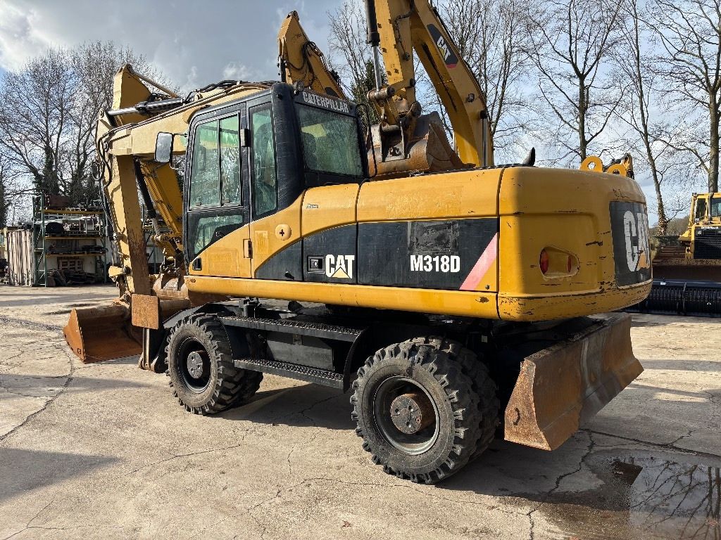2008 Caterpillar M318D wheel excavator, rear three-quarter view 2008 Caterpillar M318D wheel excavator, rear three-quarter view