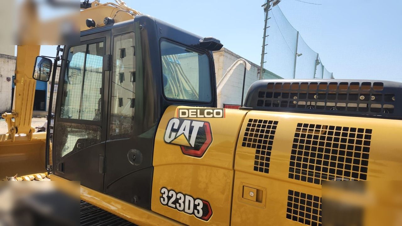 2026 Caterpillar 323D3 crawler excavator cab and engine cover side view 2026 Caterpillar 323D3 crawler excavator cab and engine cover side view