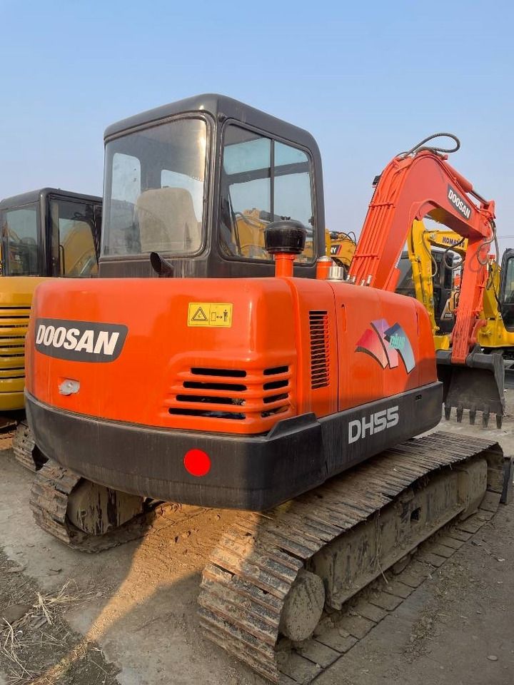 2024 Doosan DH55 mini excavator, rear three-quarter view 2024 Doosan DH55 mini excavator, rear three-quarter view