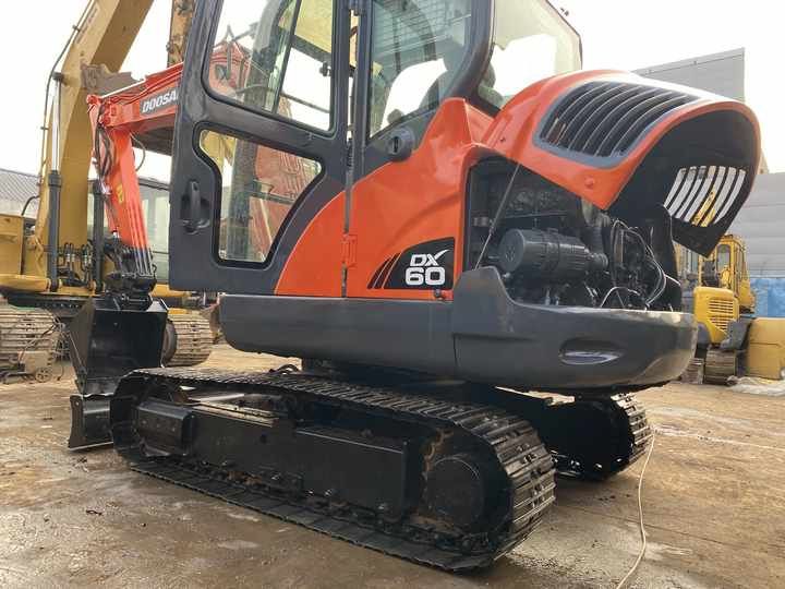 2022 Doosan DX60 crawler excavator, side view with engine cover open