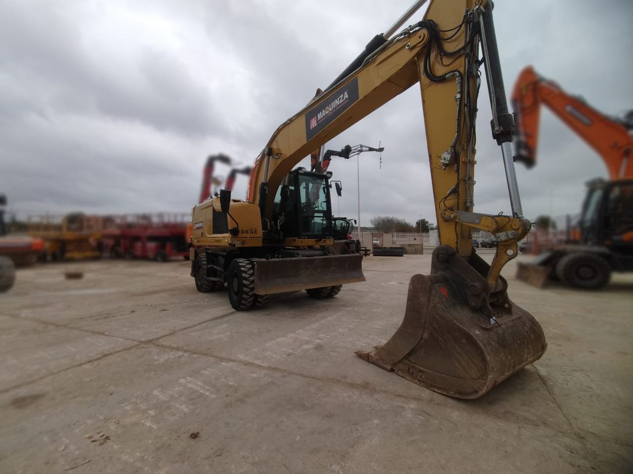 2018 Caterpillar M320F wheel excavator, front three-quarter view 2018 Caterpillar M320F wheel excavator, front three-quarter view
