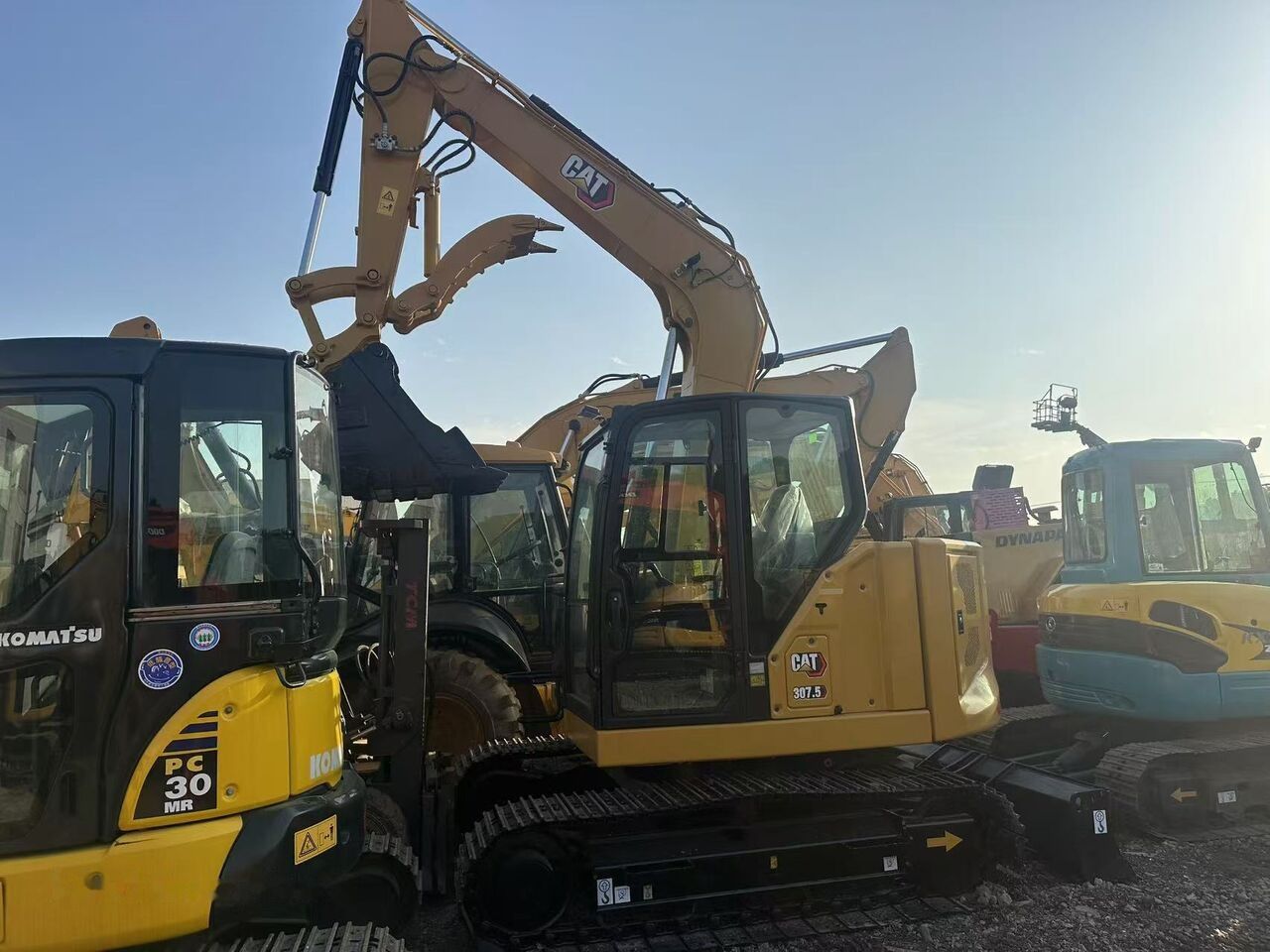 Caterpillar 307.5 crawler excavator, side view Caterpillar 307.5 crawler excavator, side view