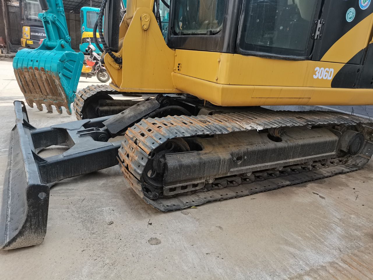 2013 Caterpillar 306D crawler excavator, side view of undercarriage and blade