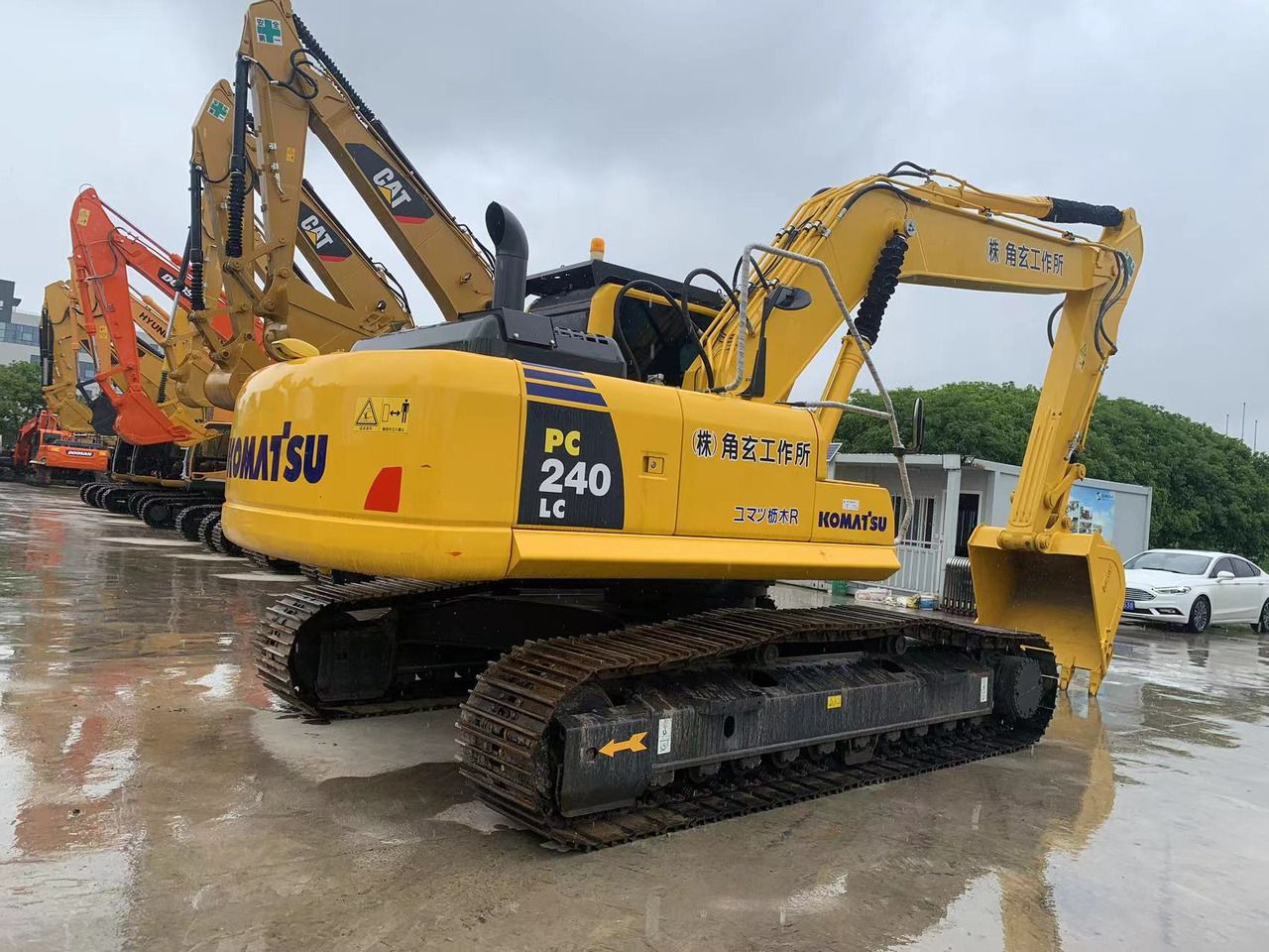 2023 Komatsu PC240LC crawler excavator, rear three-quarter view 2023 Komatsu PC240LC crawler excavator, rear three-quarter view