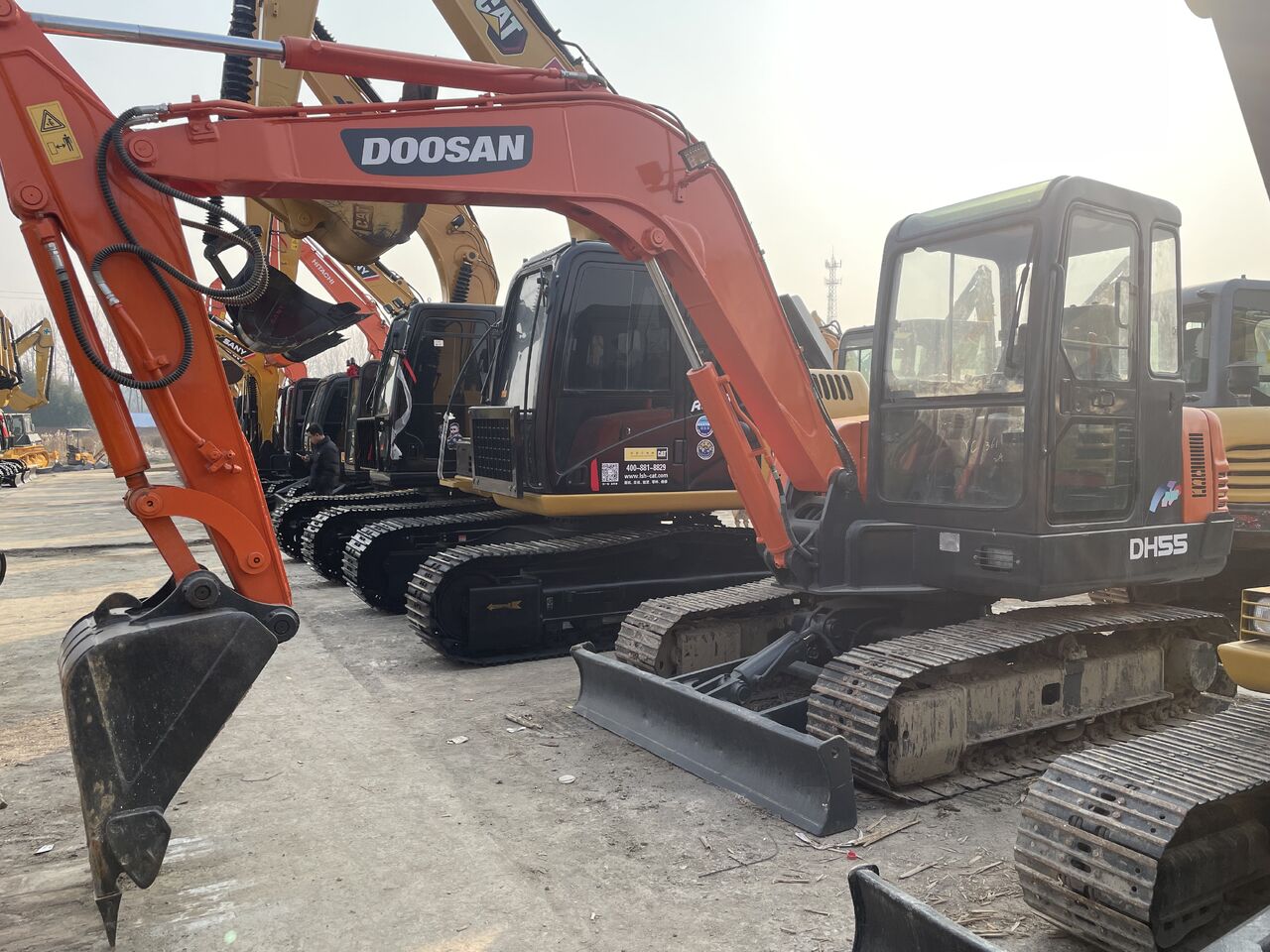 2023 Doosan DH55 mini excavator, side view 2023 Doosan DH55 mini excavator, side view