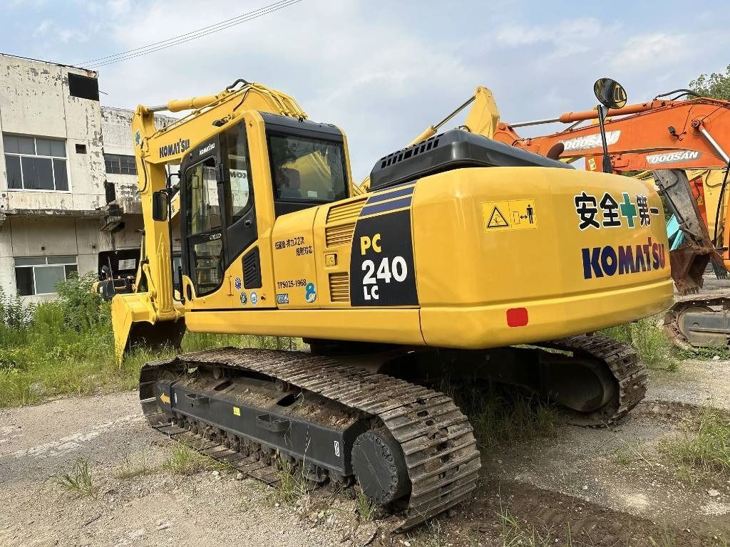 2023 Komatsu PC240LC excavator, rear three-quarter view 2023 Komatsu PC240LC excavator, rear three-quarter view