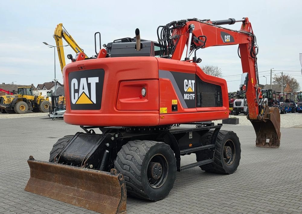 2019 Caterpillar M317F wheel excavator, rear three-quarter view 2019 Caterpillar M317F wheel excavator, rear three-quarter view