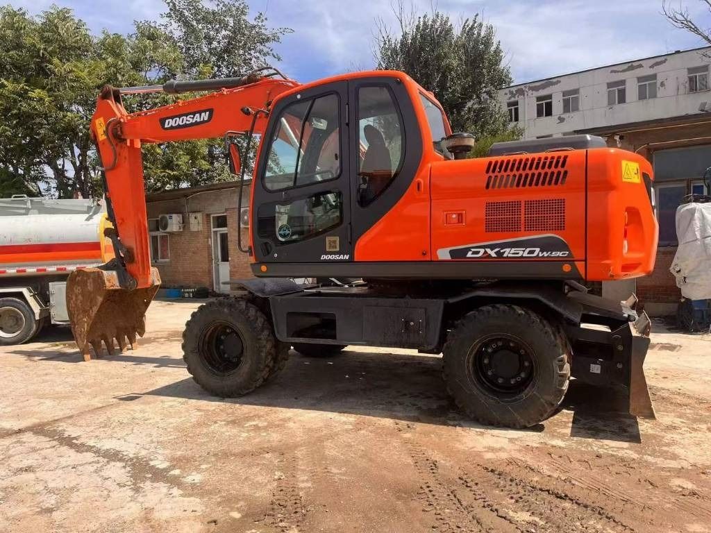 2024 Doosan DX150W-9C wheel excavator, side profile view 2024 Doosan DX150W-9C wheel excavator, side profile view