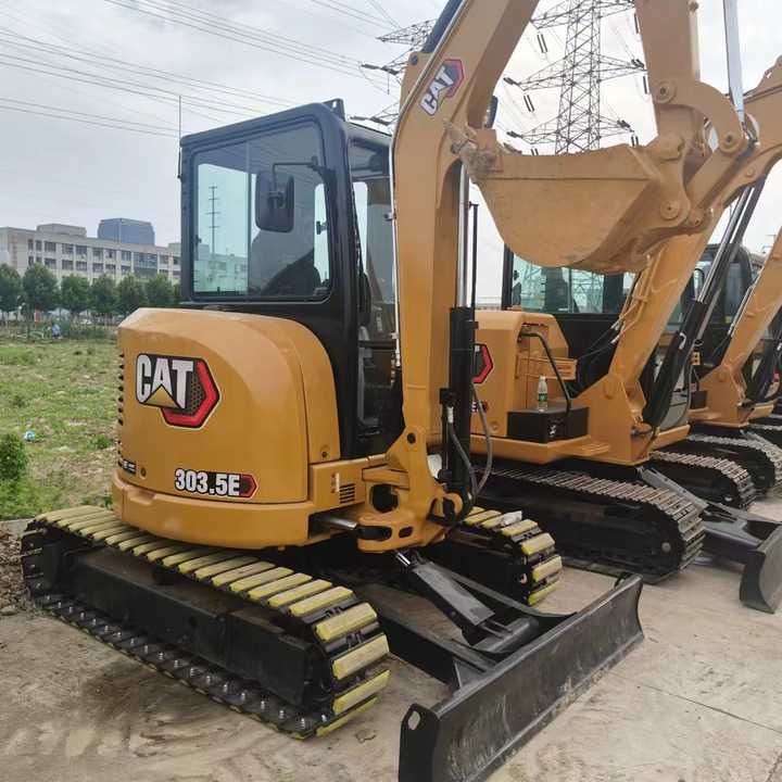 2023 Caterpillar 303.5E mini excavator, rear three-quarter view