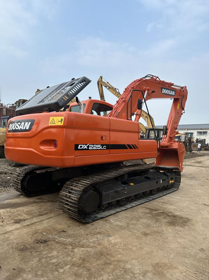 2023 Doosan DX225LC crawler excavator, rear three-quarter view 2023 Doosan DX225LC crawler excavator, rear three-quarter view