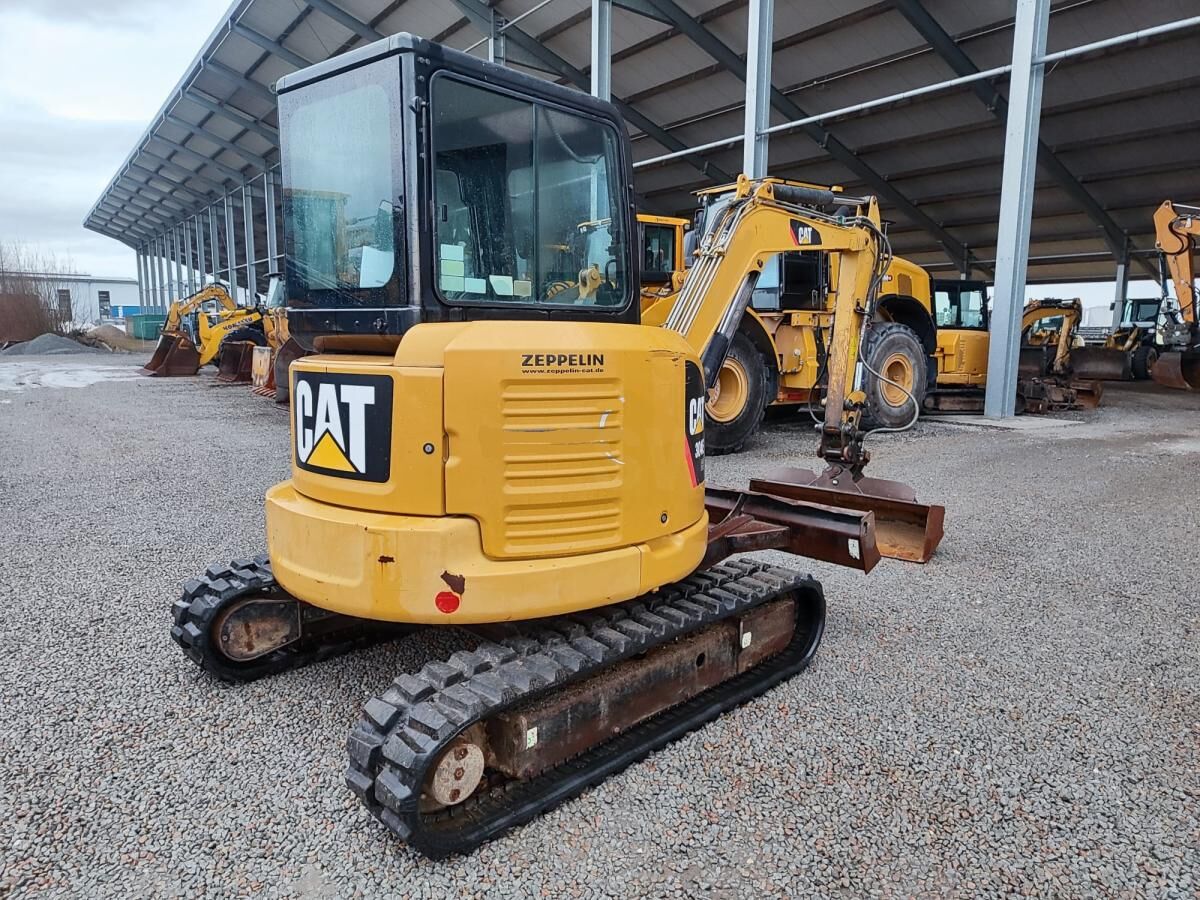 2012 Caterpillar 304E mini excavator, rear three-quarter view