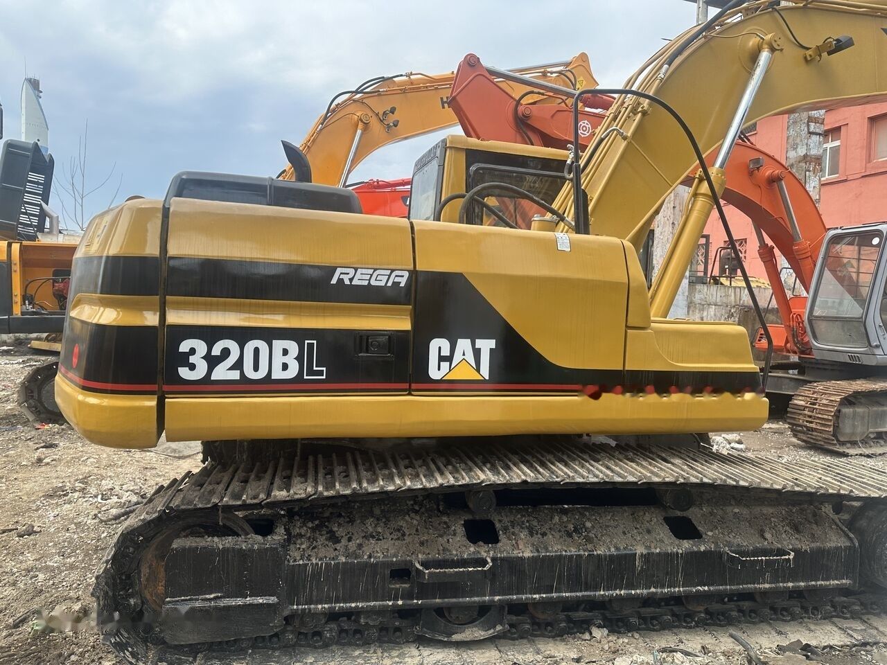 Caterpillar 320BL crawler excavator, side view Caterpillar 320BL crawler excavator, side view