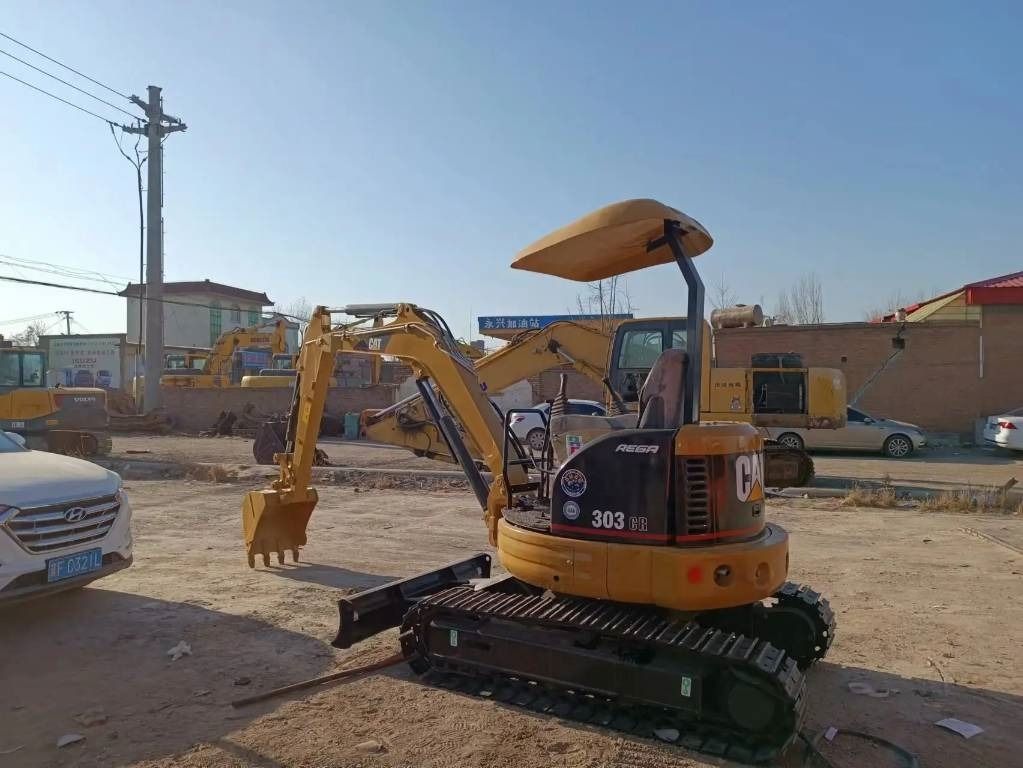 2022 Caterpillar 303 CR mini excavator, rear three-quarter view 2022 Caterpillar 303 CR mini excavator, rear three-quarter view