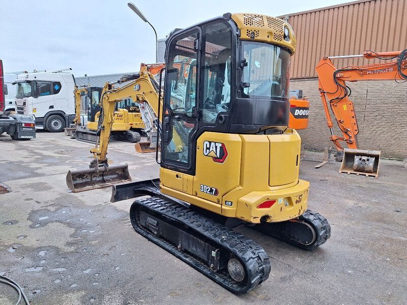 2022 Caterpillar 302.7 mini excavator, rear three-quarter view 2022 Caterpillar 302.7 mini excavator, rear three-quarter view