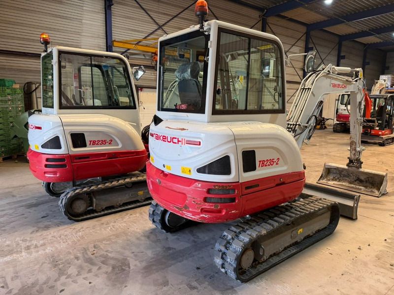 2023 Takeuchi TB235-2 mini excavator rear three-quarter view 2023 Takeuchi TB235-2 mini excavator rear three-quarter view