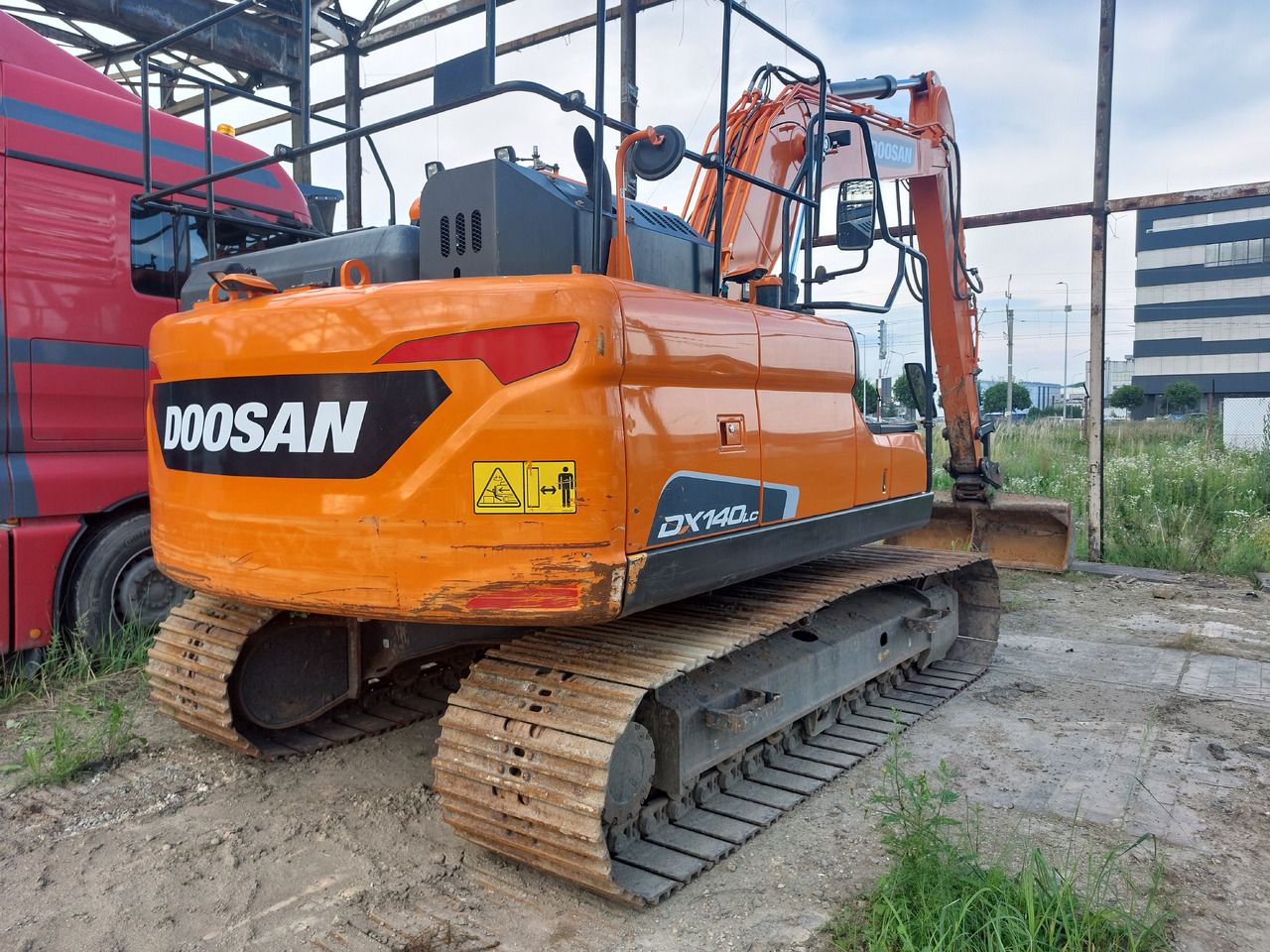 2021 Doosan DX140LC-5 crawler excavator, rear three-quarter view 2021 Doosan DX140LC-5 crawler excavator, rear three-quarter view
