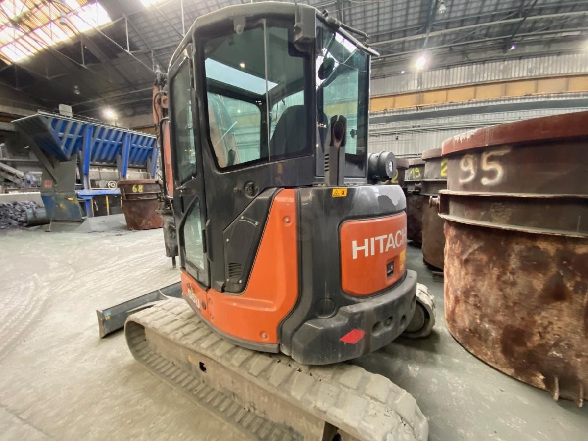 2021 Hitachi ZAXIS 55U mini excavator, rear three-quarter view 2021 Hitachi ZAXIS 55U mini excavator, rear three-quarter view