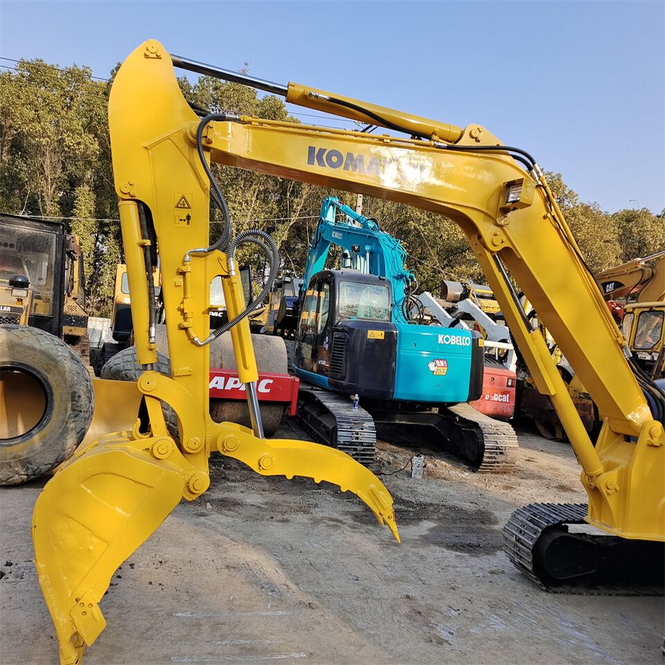 2024 Komatsu PC55 crawler excavator, side view of boom and thumb attachment 2024 Komatsu PC55 crawler excavator, side view of boom and thumb attachment