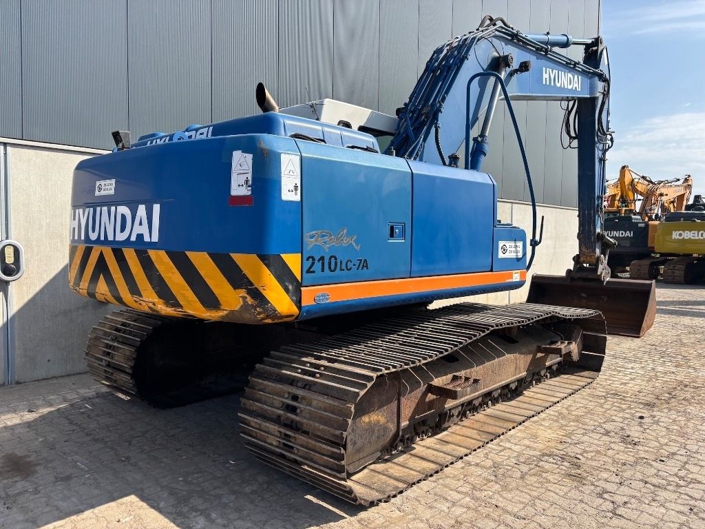 2009 Hyundai R210LC-7A crawler excavator, rear three-quarter view 2009 Hyundai R210LC-7A crawler excavator, rear three-quarter view