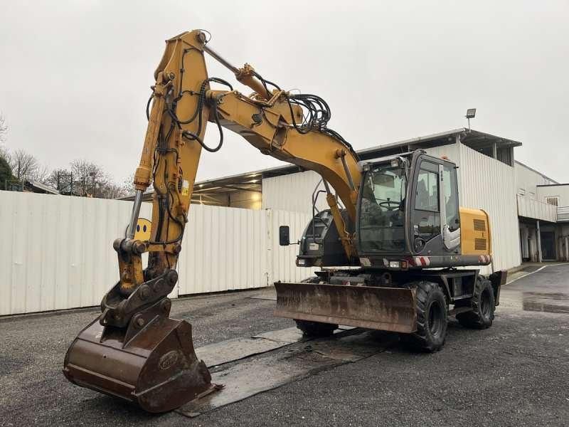 2010 Hitachi ZX140W-3 wheel excavator, front three-quarter view 2010 Hitachi ZX140W-3 wheel excavator, front three-quarter view