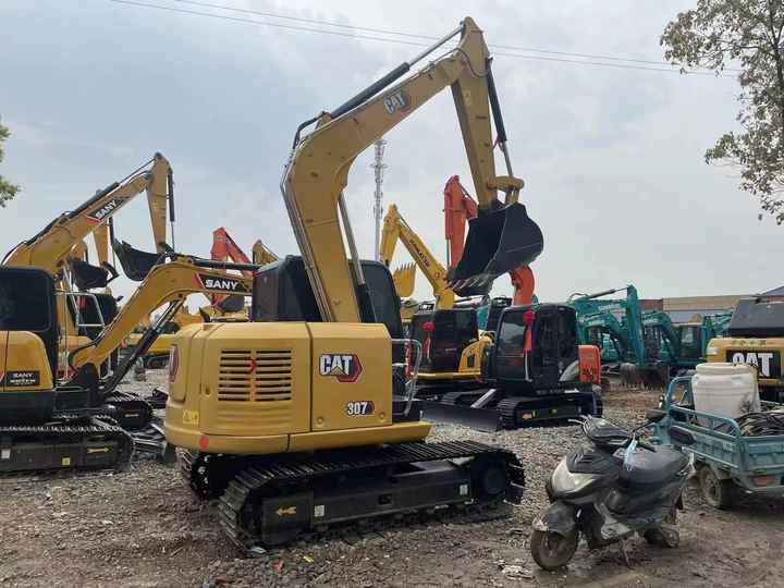 2024 Caterpillar 307E excavator, rear three-quarter view 2024 Caterpillar 307E excavator, rear three-quarter view