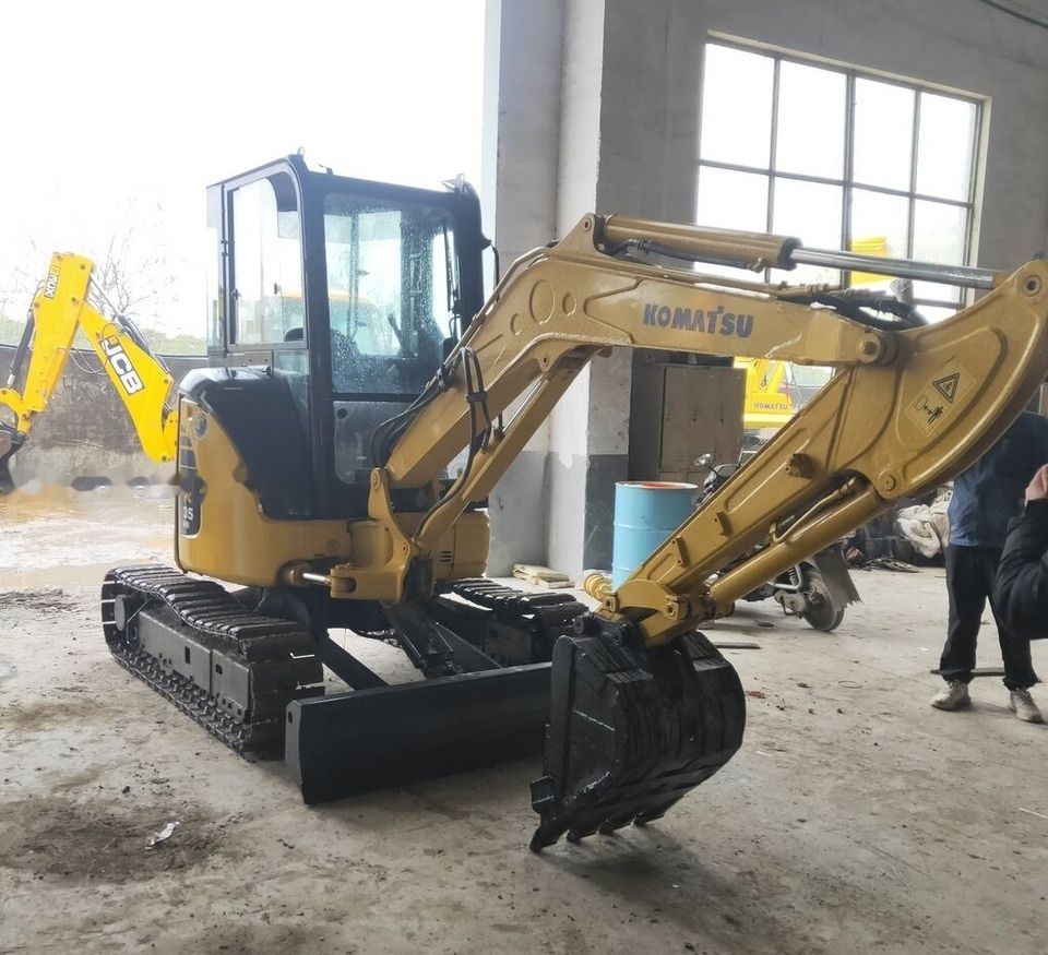 Komatsu PC35 mini excavator, side view Komatsu PC35 mini excavator, side view
