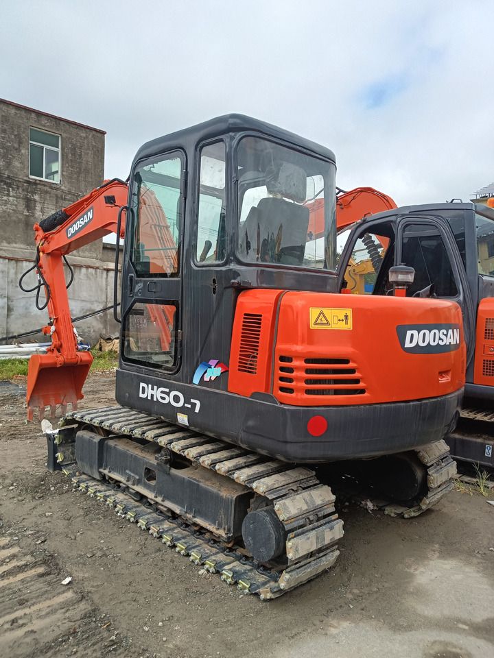 2022 Doosan DH60-7 mini excavator, rear three-quarter view 2022 Doosan DH60-7 mini excavator, rear three-quarter view