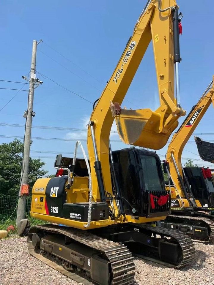 2024 Caterpillar 312D mini excavator, rear three-quarter view