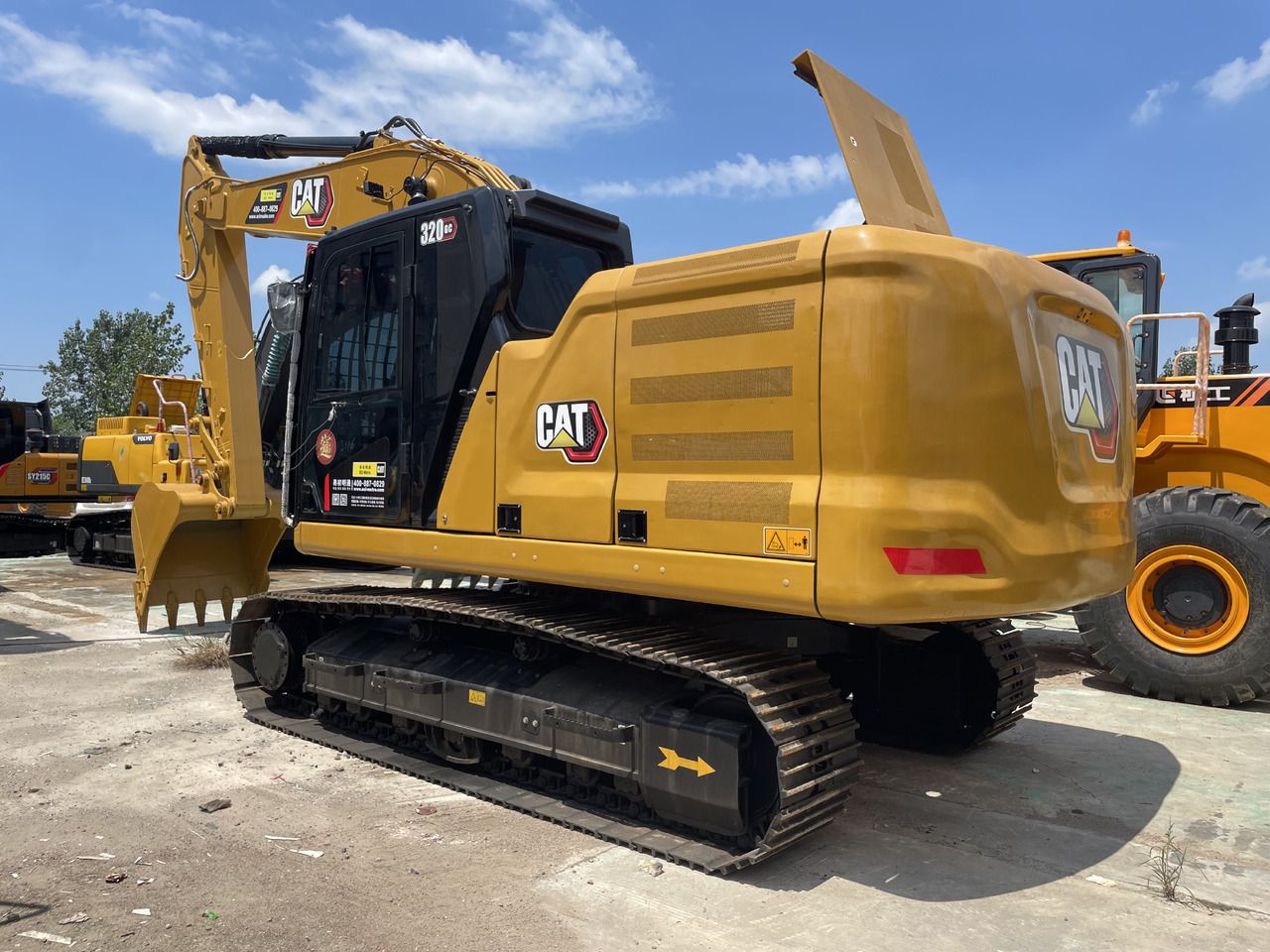 2023 Caterpillar 320GC crawler excavator, rear three-quarter view 2023 Caterpillar 320GC crawler excavator, rear three-quarter view