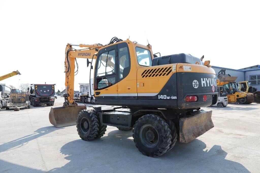 2015 Hyundai R140W-9A wheel excavator, rear three-quarter view 2015 Hyundai R140W-9A wheel excavator, rear three-quarter view