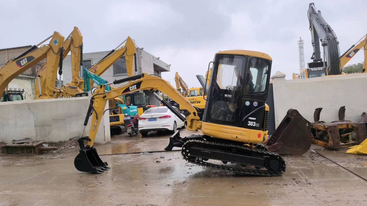 Caterpillar 303CR mini excavator, side profile view