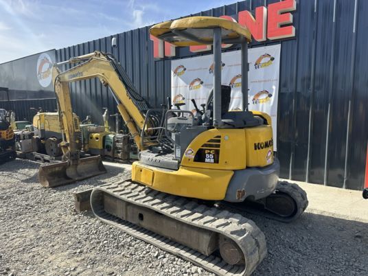2014 Komatsu PC55MR-3 mini excavator, rear three-quarter view 2014 Komatsu PC55MR-3 mini excavator, rear three-quarter view
