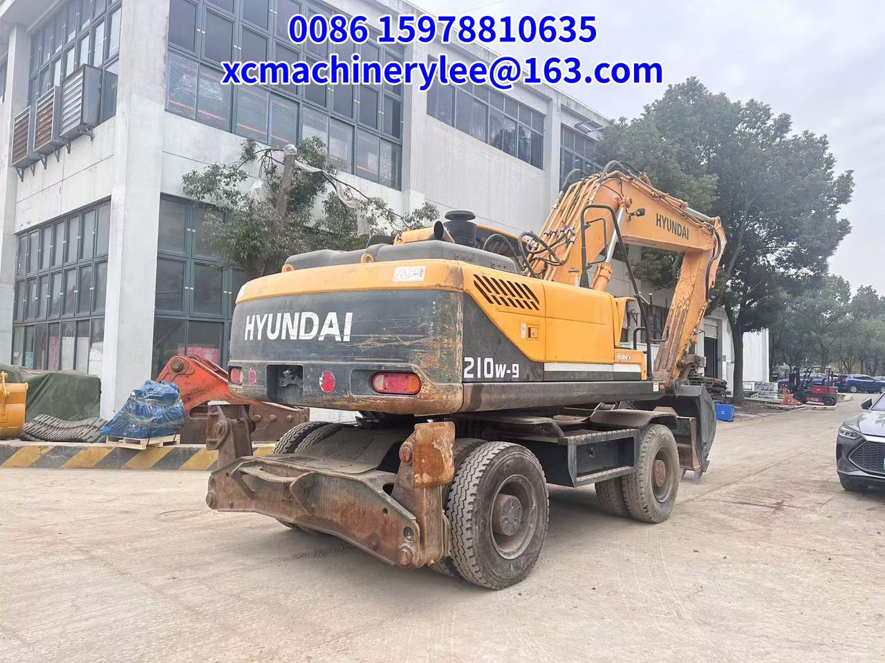 2022 Hyundai R210W-9 wheel excavator rear three-quarter view