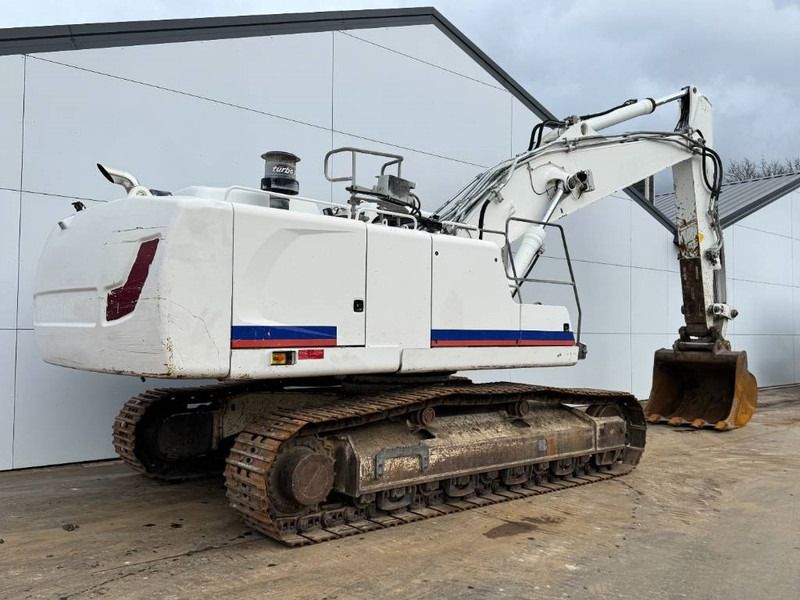 2016 Liebherr R 946 crawler excavator, rear three-quarter view 2016 Liebherr R 946 crawler excavator, rear three-quarter view