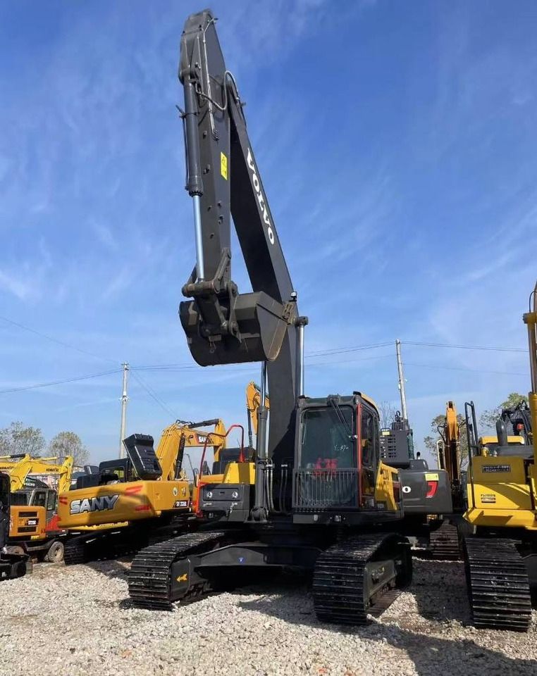 2025 Volvo EC240 crawler excavator, front view with raised boom