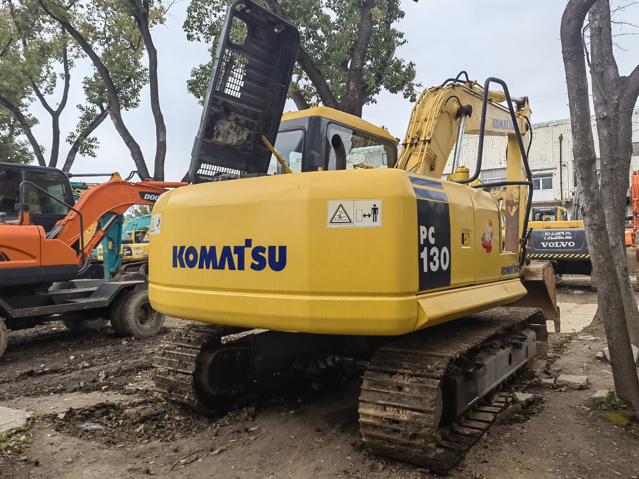 2018 Komatsu PC130-7 excavator, rear three-quarter view 2018 Komatsu PC130-7 excavator, rear three-quarter view