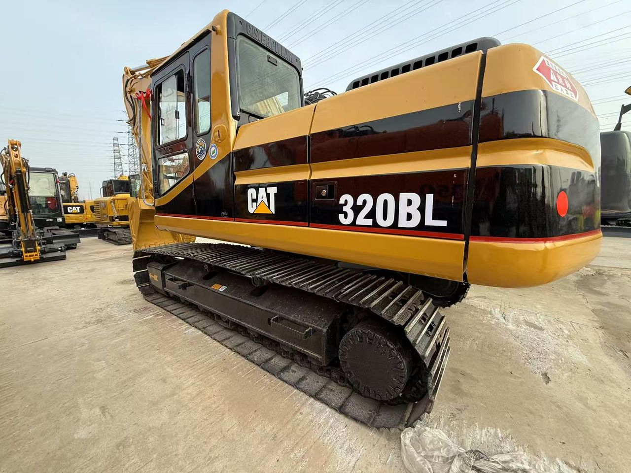 2013 Caterpillar 320BL crawler excavator, rear three-quarter view