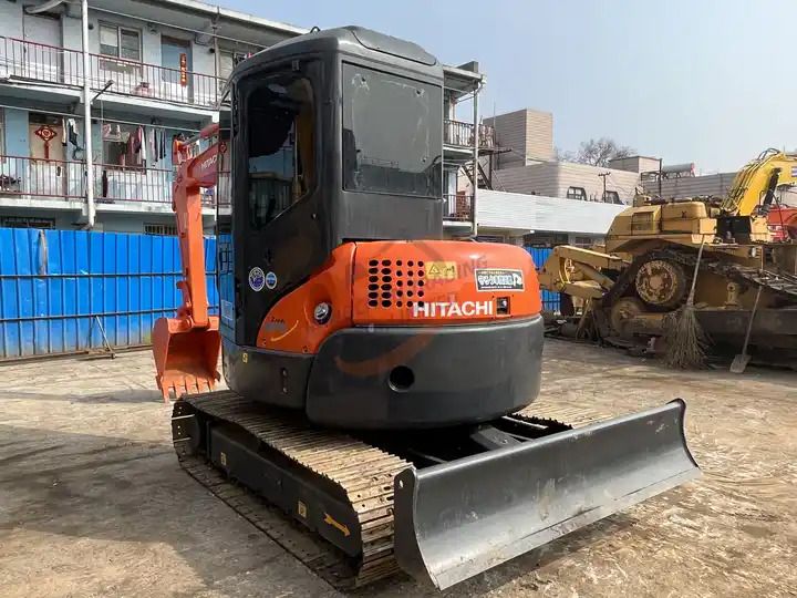 2018 Hitachi ZX55UR mini excavator, rear three-quarter view 2018 Hitachi ZX55UR mini excavator, rear three-quarter view