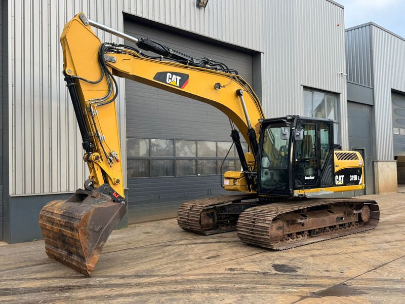 2011 Caterpillar 319DL crawler excavator, side view