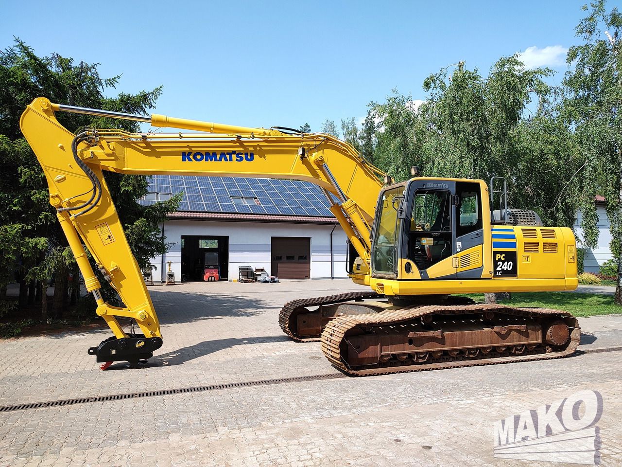 2012 Komatsu PC240LC-10 crawler excavator, side profile view