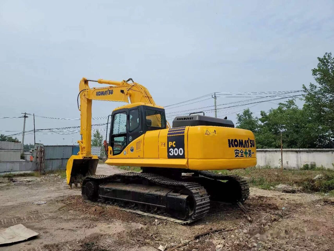 2018 Komatsu PC300-7 crawler excavator, rear three-quarter view 2018 Komatsu PC300-7 crawler excavator, rear three-quarter view