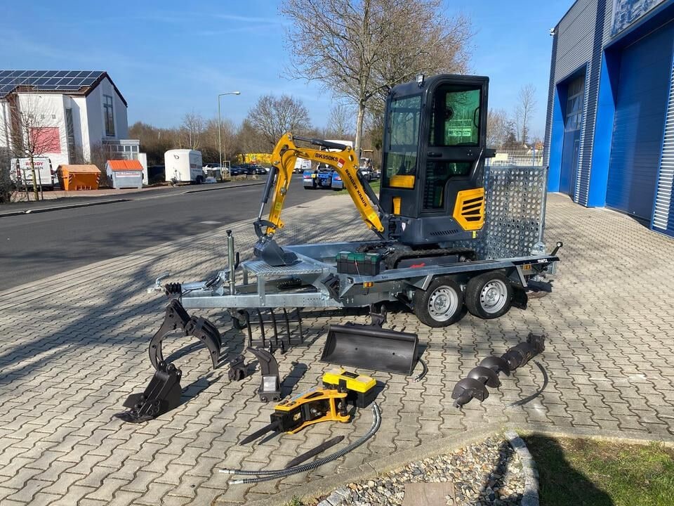 Berger Kraus BK950KS mini excavator on trailer with attachments
