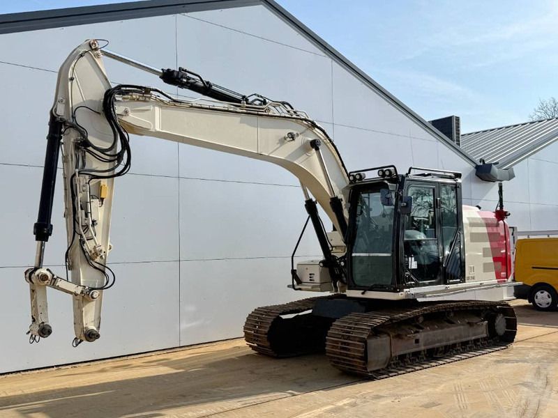 2012 Caterpillar 316EL crawler excavator side view 2012 Caterpillar 316EL crawler excavator side view
