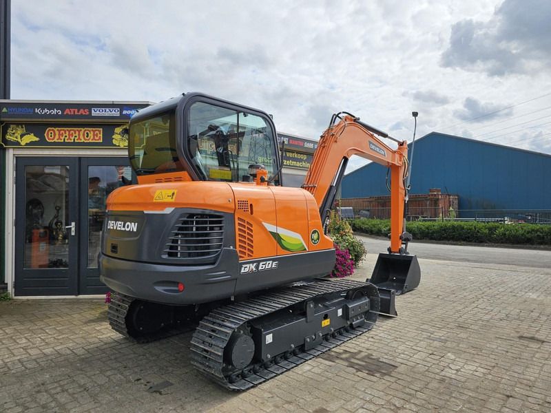 2024 Develon DX60E-10N mini excavator, rear three-quarter view
