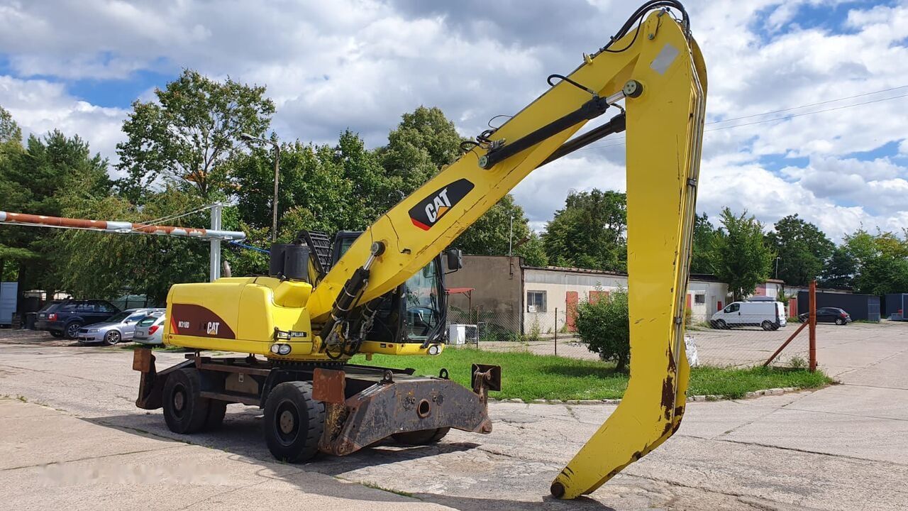 2011 Caterpillar M318D MH material handler, side view 2011 Caterpillar M318D MH material handler, side view